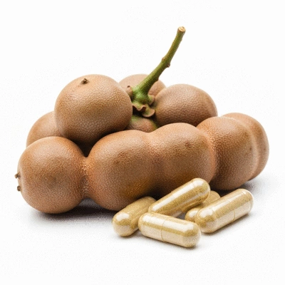 Close-up of Garcinia Cambogia fruit with capsules on a clean, light background