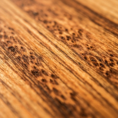 African mango fruit and seeds on a wooden table, with a clean background